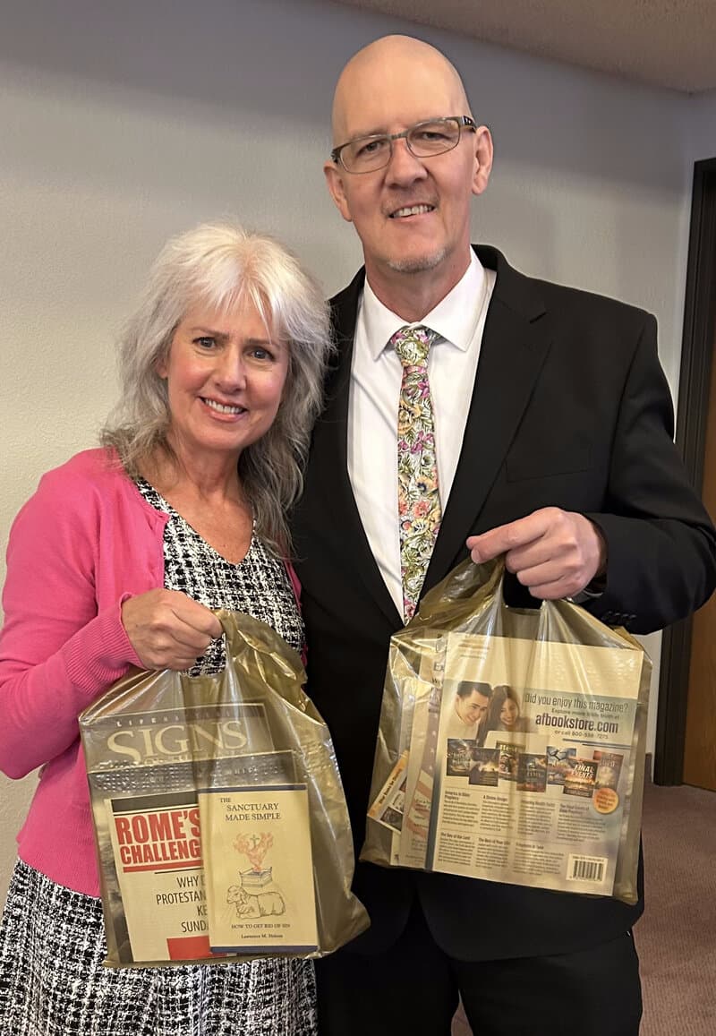 Wylie and Dawna holding ministry literature